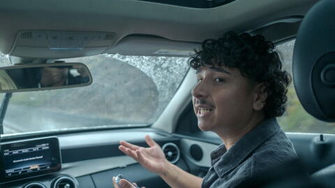 Community activist Arturo Gonzalez sits in a vehicle during his Immigration and Customs Enforcement monitoring ride on Oct. 12, 2026.