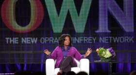 Oprah Winfrey talks to reporters during a press tour that followed the launch of her cable network, OWN, in January.