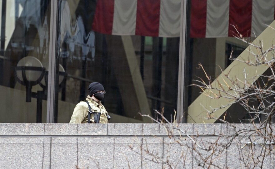 A National Guard soldier stands on an outside balcony at the Hennepin County Government Center last week in Minneapolis where the trial of former police officer Derek Chauvin for the death of George Floyd continues.