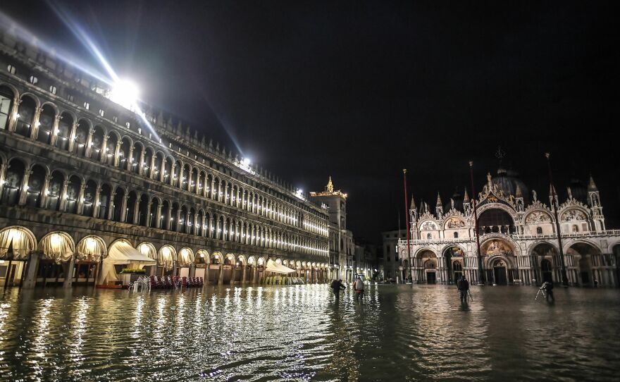 The flooded Piazza San Marco square, with the San Marco Basilica are pictured during a high tide water level on Nov. 12, 2019 in Venice.