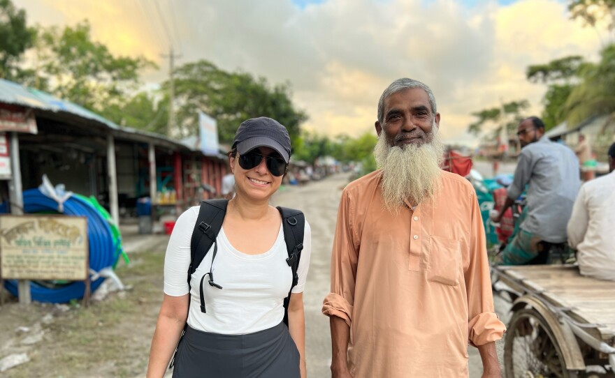 Physician and podcast Céline Gounder traveled to Bangladesh in 2022 to track down South Asian public health workers who were part of the battle to end smallpox nearly 50 years ago. Gounder is pictured with Delowar Hossain, who was part of the smallpox eradication campaign.