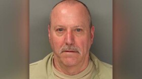 An undated mug shot of Michale James Poulsom.