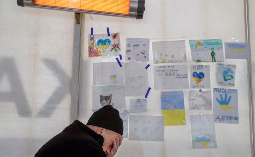 A man rests after his arrival at a hub for displaced people in Zaporizhzhia, some 124 miles northwest of Mariupol, on April 5. Residents of the besieged city have scattered as they evacuate.