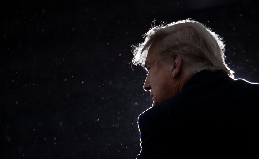 President Trump addresses a rally this week at Capital Region International Airport in Lansing, Mich.