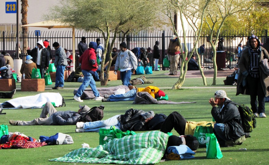 The homeless battle freezing temperatures outside Central Arizona Shelter Services near downtown Phoenix.