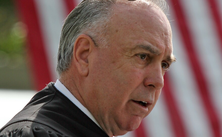 Judge T. S. Ellis III presides over a naturalization ceremony at Arlington National Cemetery in 2008.
