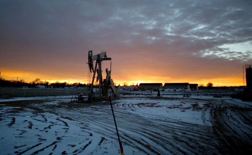 A pump-jack sits atop a oil well near downtown Sidney, Mont. The oil boom has brought thousands of new residents to the town, almost all of whom work in the Bakken oil fields in Montana and North Dakota. Sidney sits at the western edge of the Bakken oil patch, one of the most productive drilling areas in the country.