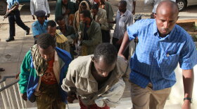 Under heavy guard, 11 Somali suspected pirates were brought to the Mombasa court Kenya. Somali pirates scooped up by U.S. and European warships are sitting in legal limbo on the high seas.
