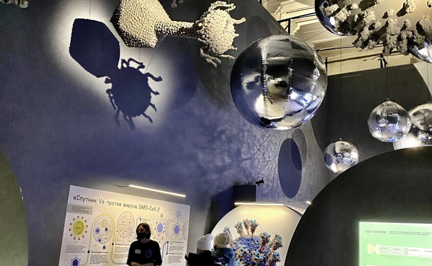 Visitors take in a tour of the "Life with Viruses" exhibit in Moscow. As of Thursday, the museum is one of few public spaces available to vaccinated Russians.