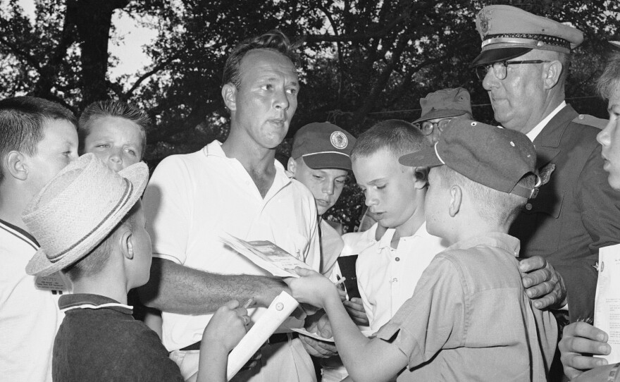 Palmer signs autographs at the Texas Open in 1962.