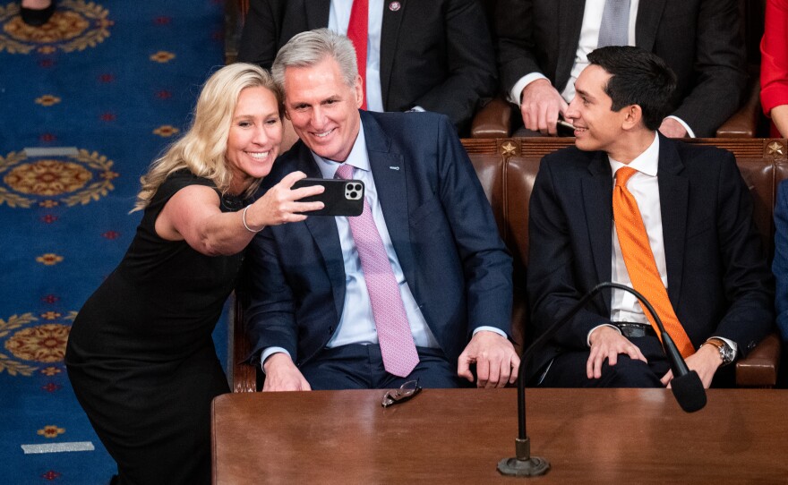 Rep. Marjorie Taylor Greene, (R-Ga.), takes a selife with Republican Leader Kevin McCarthy, (R-CA) at the end of the 15th vote after he received enough votes to become Speaker of the House.