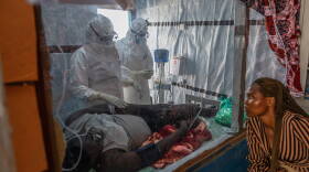 Health workers tend to an Ebola patient at the Rwampara Treatment Center in Ituri, Congo, Thursday, June 18, 2026.