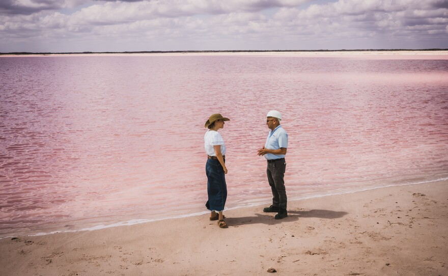 Engineer Felipe Perez takes Pati to the pink lakes where the salt is produced.