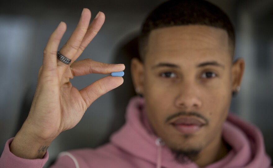 D.C. resident Ricardo Cooper is gay and HIV-negative. He says he's been taking a daily blue PrEP pill for the last six months, with few side effects. The drug gives him peace of mind, he says.