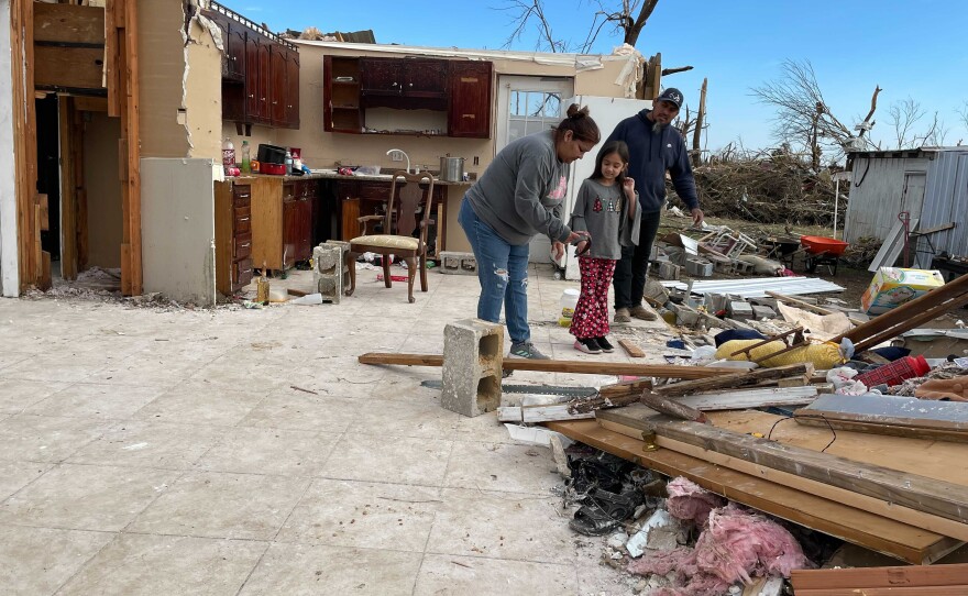 The Valeros sort through what is left of their home. For now, they're staying with Beatrice's mother.
