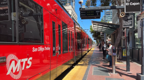 Riders wait to board the Blue Line trolley at the Fifth Avenue station in downtown San Diego on Wednesday, May 6, 2026.