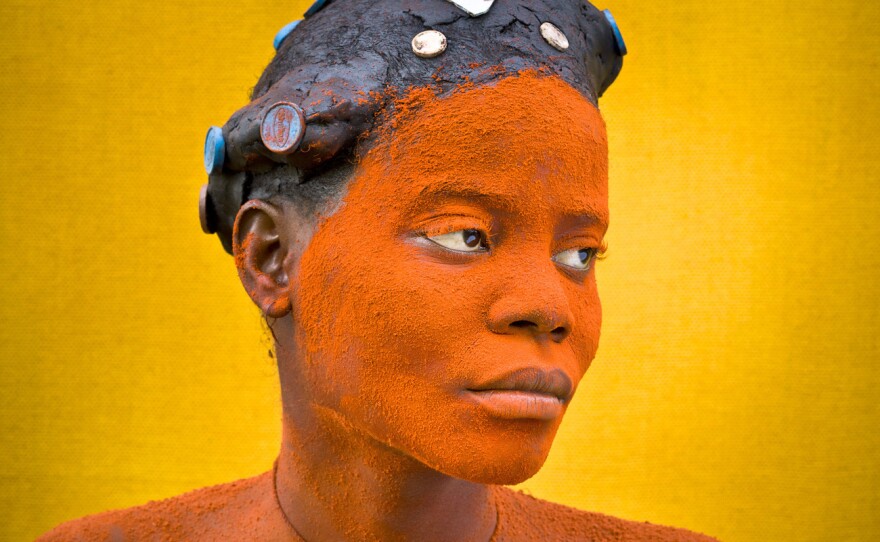For the Ekondas pygmies in the Democratic Republic of Congo, the most important moment in a woman's life is the birth of her first child. The young mother goes through  an elaborate beautification ritual to draw attention to herself, spreading pastes of palm oil and other ingredients over her hair and body.