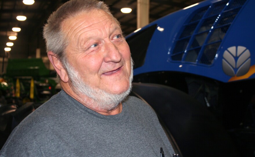 Farmer Rick Kroll, of New Bloomfield, Mo., looks at a tractor as he visits Kansas City's Western Farm Show.