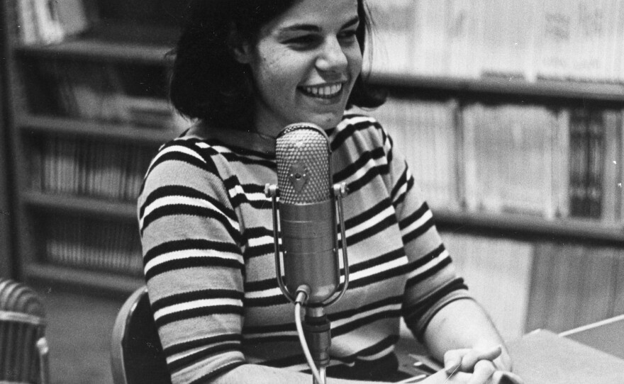 The earliest photo of Susan Stamberg at a microphone, age 25. Later, as the host of <em>All Things Considered,</em> she was the first woman to be a full-time anchor of a U.S. national nightly news broadcast.