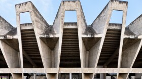 The Sardar Vallabhbhai Patel Municipal Stadium in Ahmedabad, India, built from 1959 to 1966. The use of concrete, cast on site, was a hallmark of post-colonial design, reflecting the affordability and ease of mixing and pouring this inexpensive material. The building is notable for the cantilevered roof that appears to float above the stadium.
