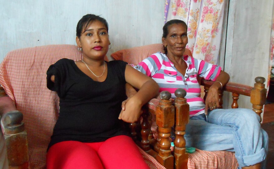 Natasha Houston and her mother at home in Zeelgult. In 2013, Houston's husband killed their two children, slashed her arm and hand, then died, apparently by suicide.