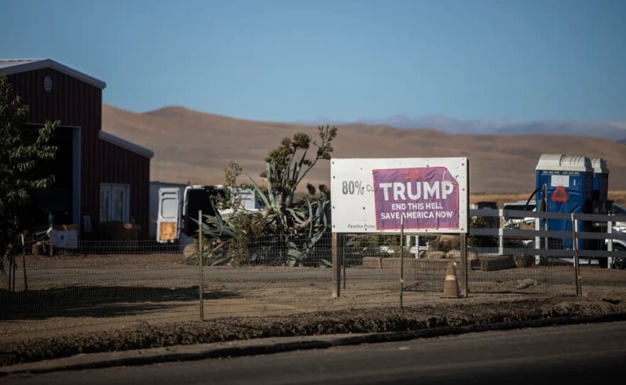 A Trump sign posted on a neighboring property of Del Bosque Farms outside of Firebaugh on Sept. 11, 2025.