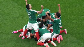 Mexico's Raul Jimenez (9) celebrates with teammates after scoring their second goal during the World Cup round of 32 soccer match between Mexico and Ecuador in Mexico City, Tuesday, June 30, 2026.