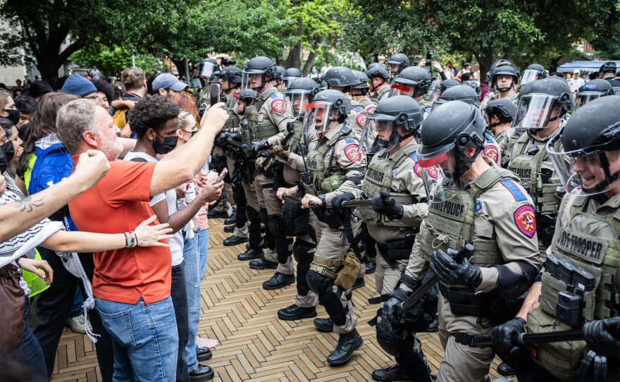 Law enforcement form a barrier while arresting students taking part in a pro-Palestinian walkout and protest on April 24, 2024, at the University of Texas at Austin.