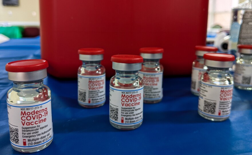 Vials of the Moderna COVID-19 vaccine thaw before being administered to residents and staffers at the Brian Center/Cabarrus nursing home in Concord, N.C.