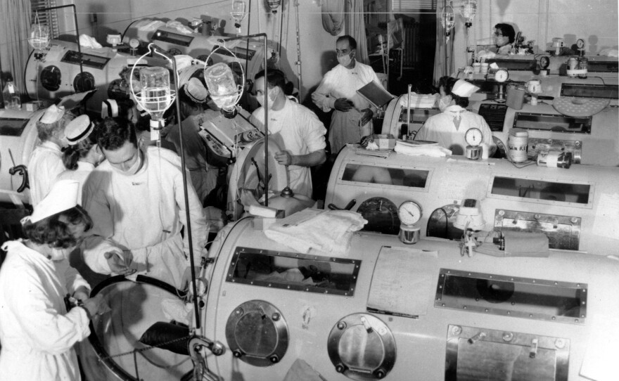 Iron lung respirators are prepared in an emergency polio ward at a Boston hospital in August 1955.