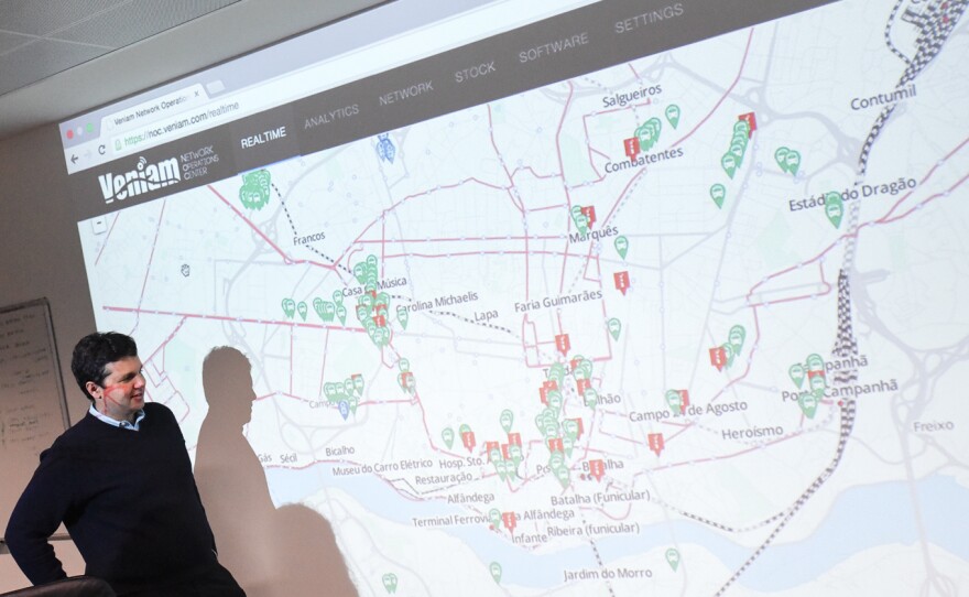 Inside Veniam's Porto office, CEO João Barros displays a map tracking Wi-Fi routers on buses from sensors planted around the city.