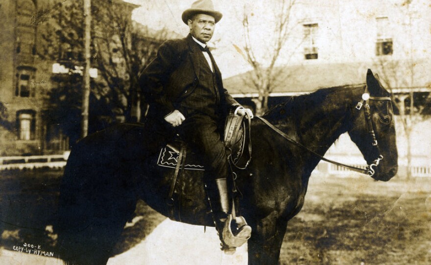 Booker T. Washington on horseback, who established Tuskegee Institute. (undated photo)