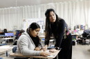 Mary Acebu, a special education teacher at Riverview Middle School in Bay Point, Calif., works with a student during a math lesson. She says using AI to help with the paperwork part of her job allows her to spend more time interacting with her students in a meaningful way.
