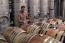Orfila Vineyards & Winery winemaker Andrew Wisniewski tests a batch of red wine, May 22, 2023.