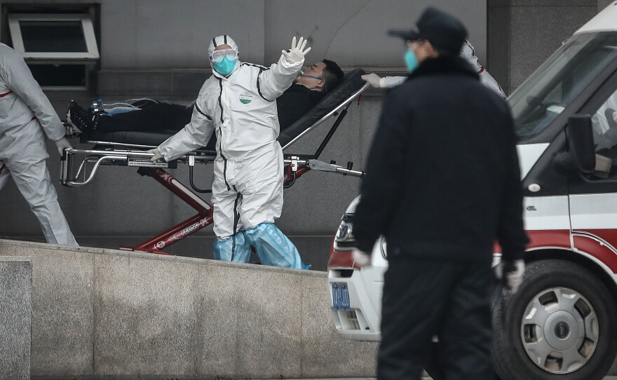 A patient is transferred to Jinyintan Hospital.