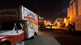 Box trucks line up as setup begins for the Lost Horizon Night Market in Oakland, Calif.