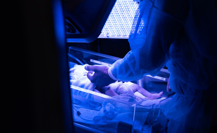 A father visits his baby who is being treated for jaundice in the NICU at Galilee hospital in Nahariya.