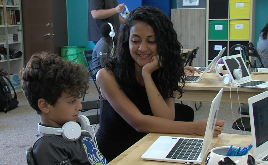 Riyam Mansoor helps Matti Matti improve his English at YALLA, June 13, 2016.