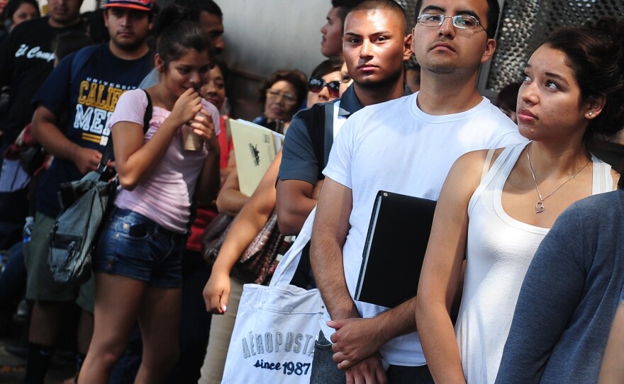 Young people stand in line in Los Angeles to apply for the Deferred Action for Childhood Arrivals program, which allows qualified immigrants who entered the U.S. illegally as children to study or work openly.