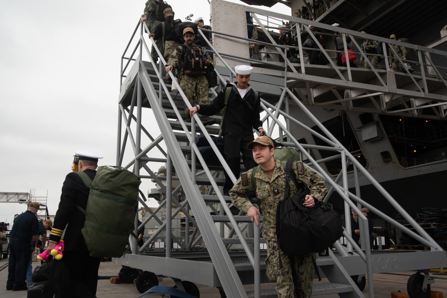 Sailors depart the aircraft carrier Theodore Roosevelt on Oct. 15, 2024 at the Naval Air Station North Island on Coronado Island.