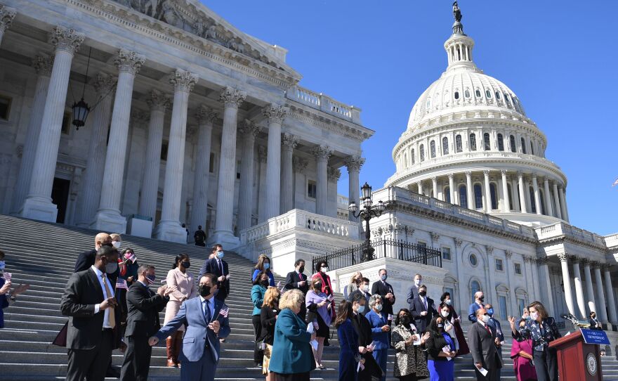 House Speaker Nancy Pelosi (right) speaks outside the U.S. Capitol in March with other members of the U.S. House of Representatives, the size of which has stayed at 435 voting members for decades.