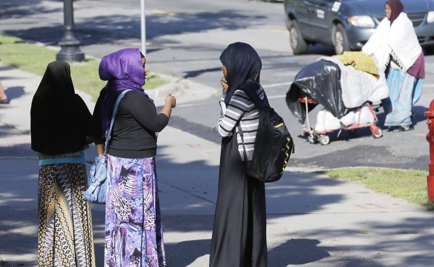 Members of the Somali community visit near a park in Minneapolis. The city is home to the nation's largest concentration of Somali Americans.