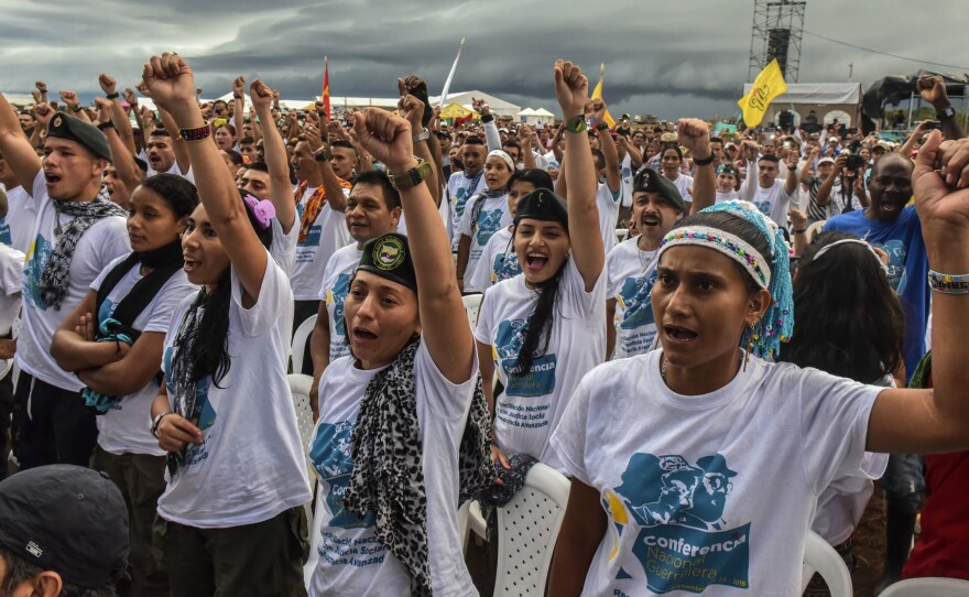 FARC members celebrate the announcement of the approval of the peace deal with the government during the closing ceremony of the 10th National Guerrilla Conference in Llanos del Yari last month. There are some 6,000 FARC guerrillas in Colombian camps. They can't start demobilizing until they are granted amnesty, but lawmakers can't act until a new peace agreement emerges.