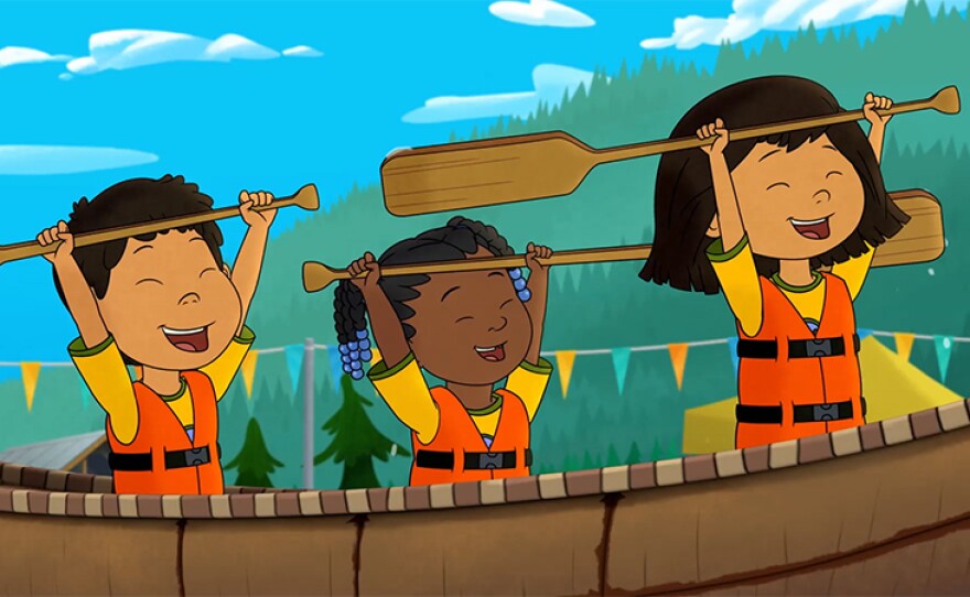 Tooey, Trini and Molly compete in a canoe race on an episode of MOLLY OF DENALI.