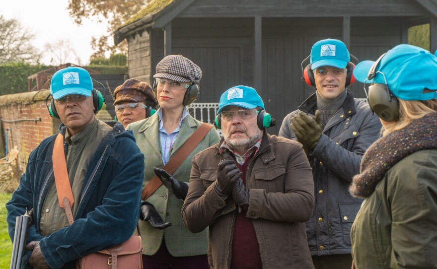 Hannah Waddingham (third from left) in a scene from MIDSOMER MURDERS “The Stitcher Society.”