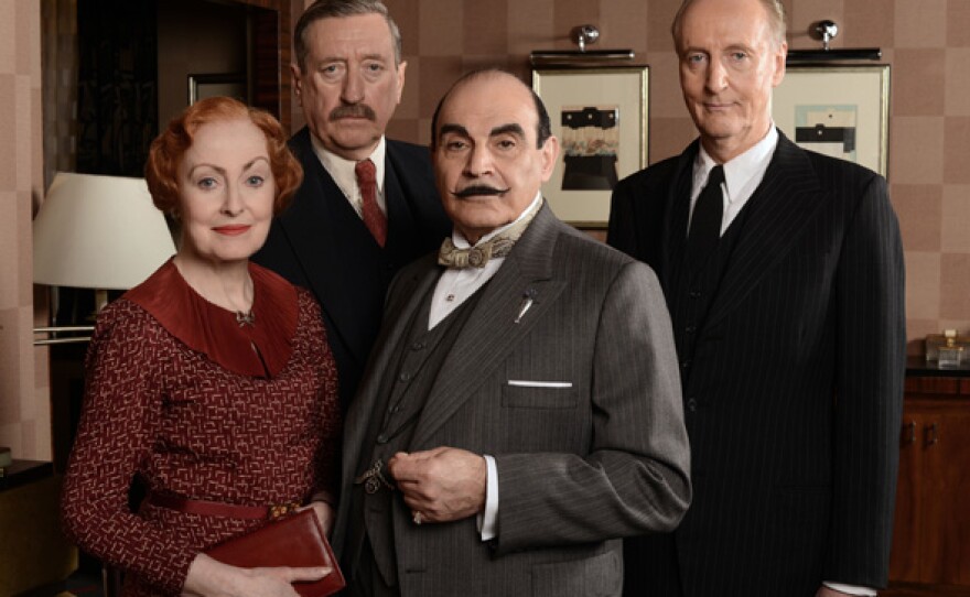 Pauline Moran as Miss Lemon, Philip Jackson as Inspector Japp, David Suchet as Poirot, and Hugh Fraser as Captain Hastings.