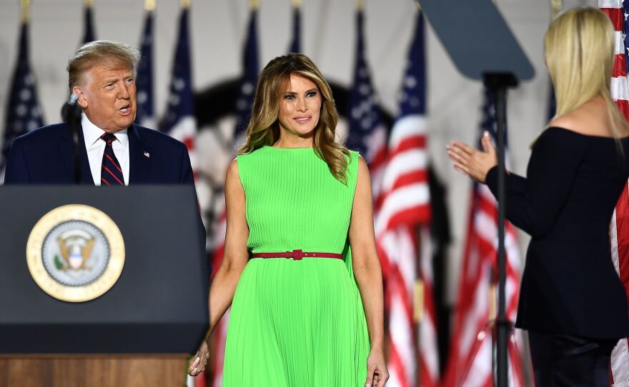 First Lady Melania Trump, center, in a bright, lime green dress at last night's Republican National Convention. It's a color begging to be photoshopped, and the Internet reliably delivered.