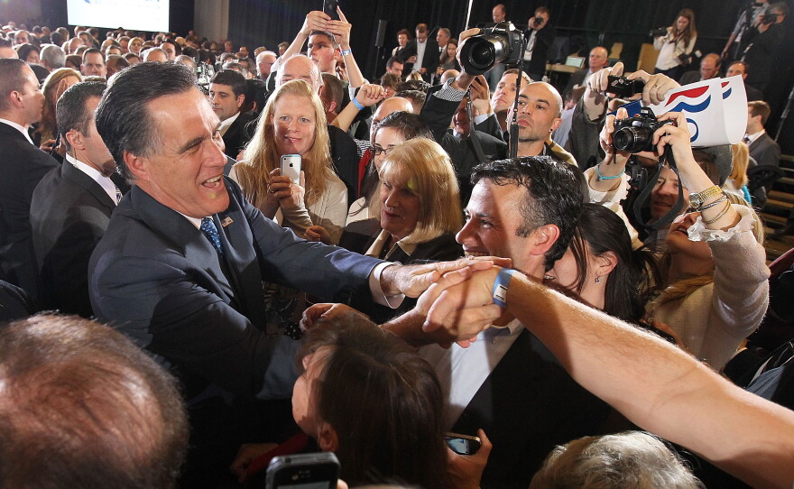 Republican presidential candidate, former Massachusetts Gov. Mitt Romney greets supporters at a Super Tuesday night gathering with his family on at the Westin Copley Place March 6, 2012 in Boston, Massachusetts. 