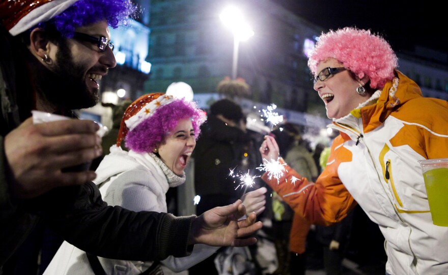 People celebrate the New Year in Madrid's Puerta del Sol square, on Jan. 1, 2011. Traditionally, the drinking doesn't begin until after midnight, when people eat 12 grapes for good luck.