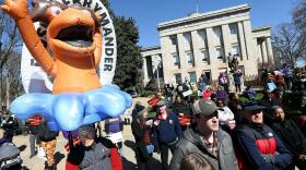 Demonstrators gather outside the North Carolina State Capitol in Raleigh, N.C., with a "FLUSH GERRYMANDER" inflatable on the day the state's highest court held a rehearing for the redistricting case known nationally as <em>Moore v. Harper</em>.